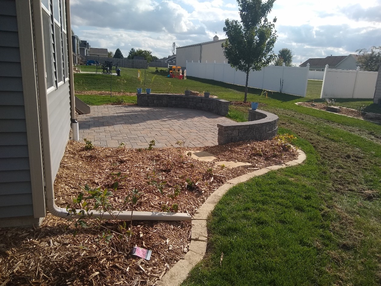 This large maple tree will provide wonderful shade for this new patio in Winterset.